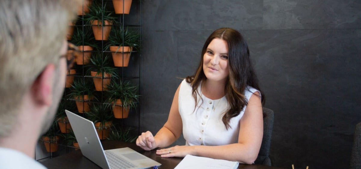 Bronagh Spence being interviewed in an office meeting room.