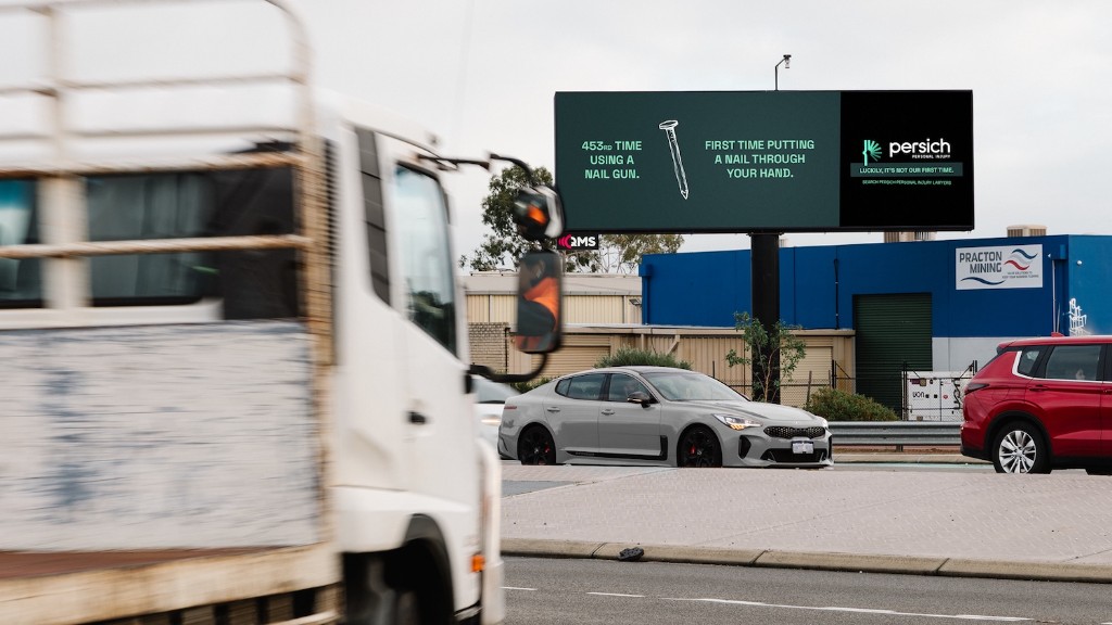 Persich Personal Injury billboard: first time putting a nail through your hand, beside Tonkin Highway traffic