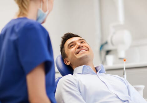 Female dentist with male patient