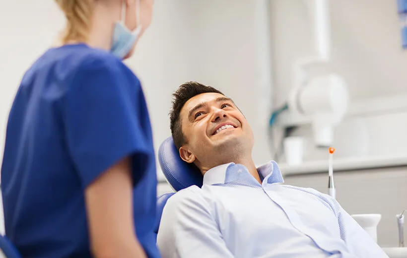 Female dentist with male patient