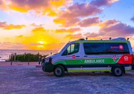 St John of God Ambulance in front of sunset