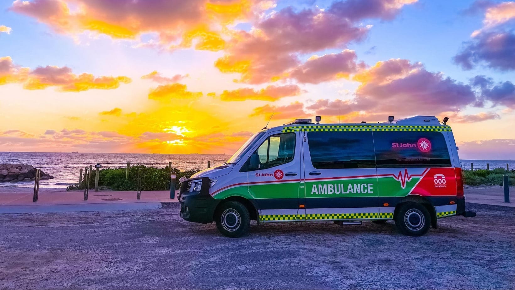 St John of God Ambulance in front of sunset