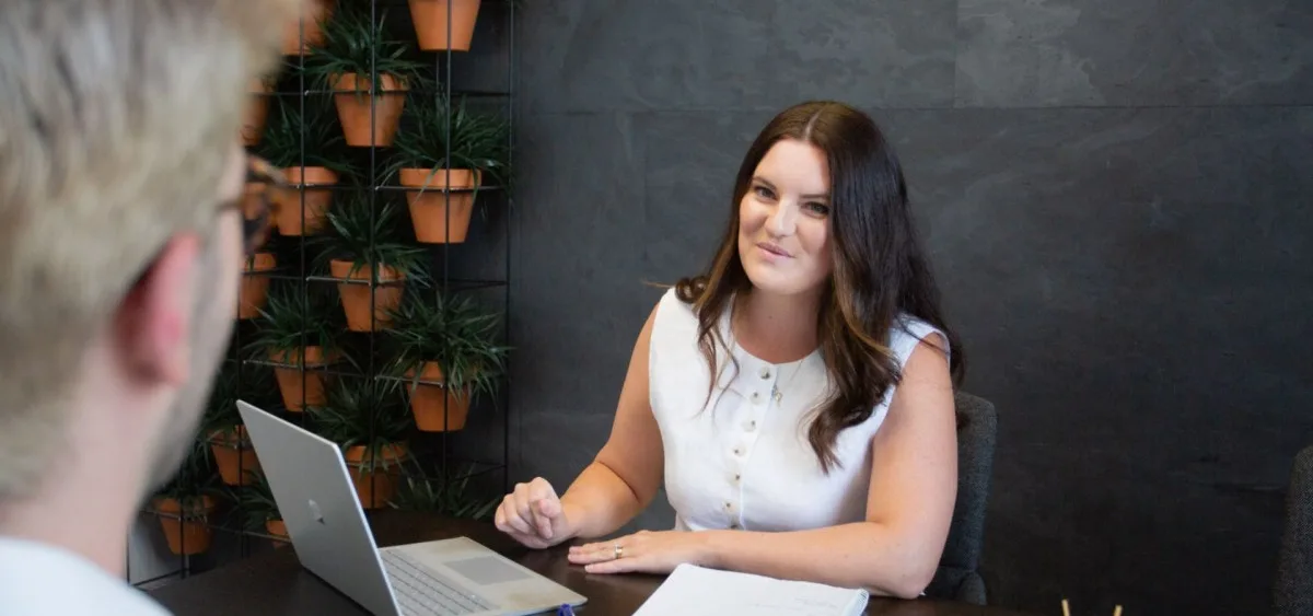 Bronagh Spence being interviewed in an office meeting room.